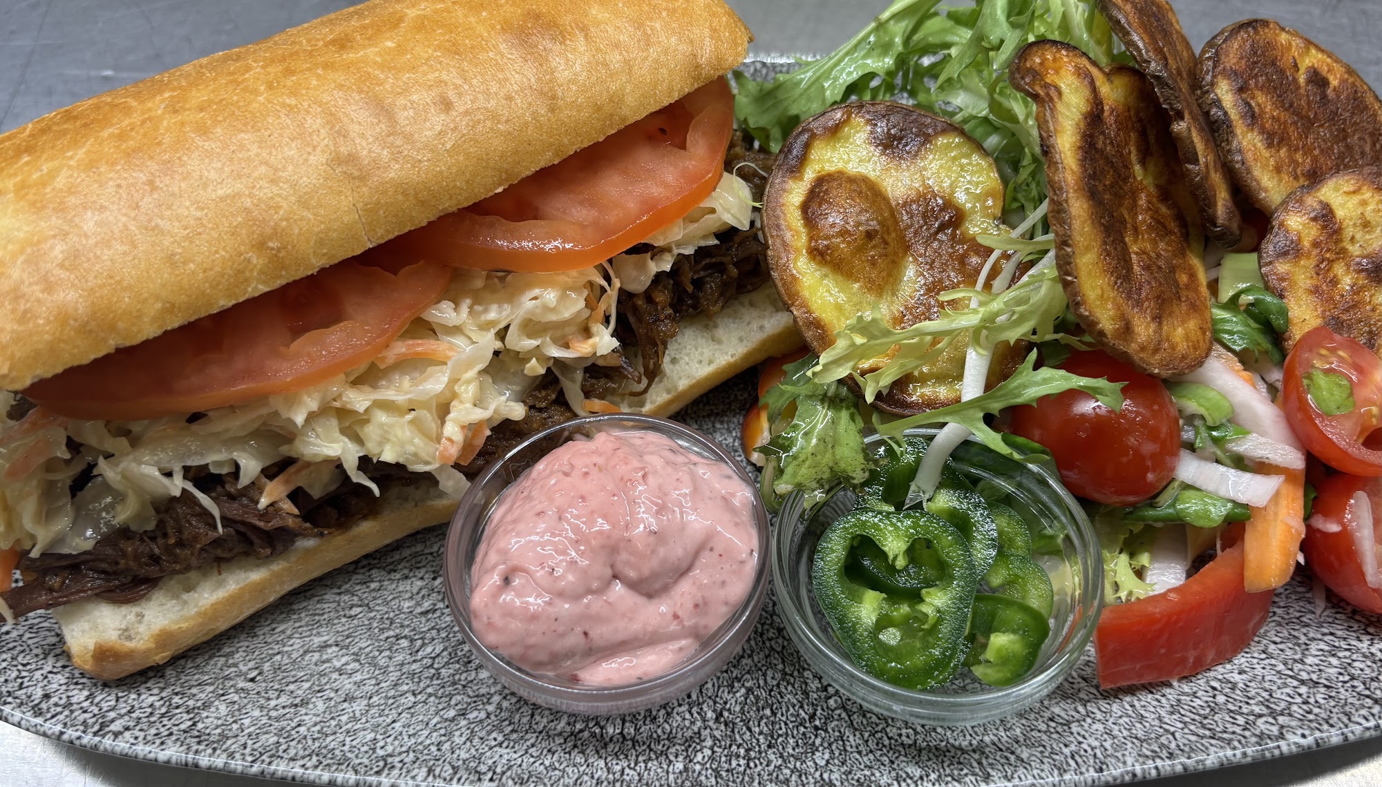 Open sandwich and salad plated at Café Derbl